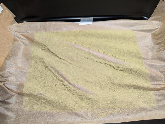 Freedom 35. Week 15 - Trim bin result for both plants. Prob don't need the wax paper.